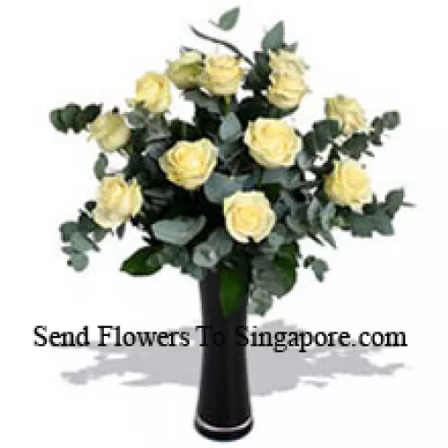 12 White Roses With Some Ferns In A Vase